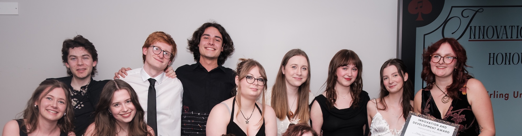 Group of 10 students dressed smartly posing for the camera at a Societies awards ceremony