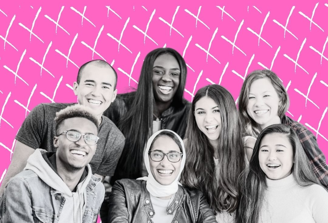 Group of seven people all smiling at the camera, there is a pink background behind with a voting crosses pattern.